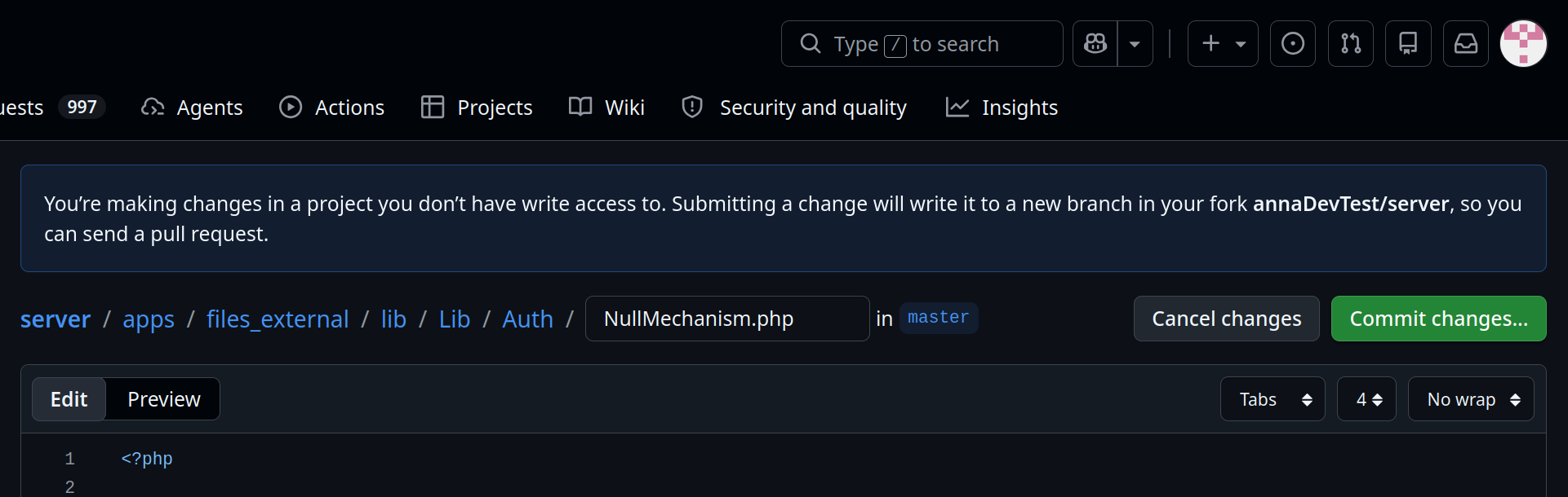 The GitHub web editor with a banner explaining that changes will be written to a new branch in the contributor's fork, and a "Commit changes..." button